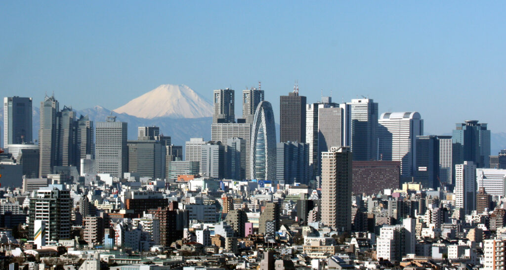 Tokyo skyscrapers with Mount Fuji in the background.