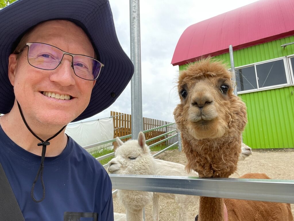 Jerry smiling with Alpaca
