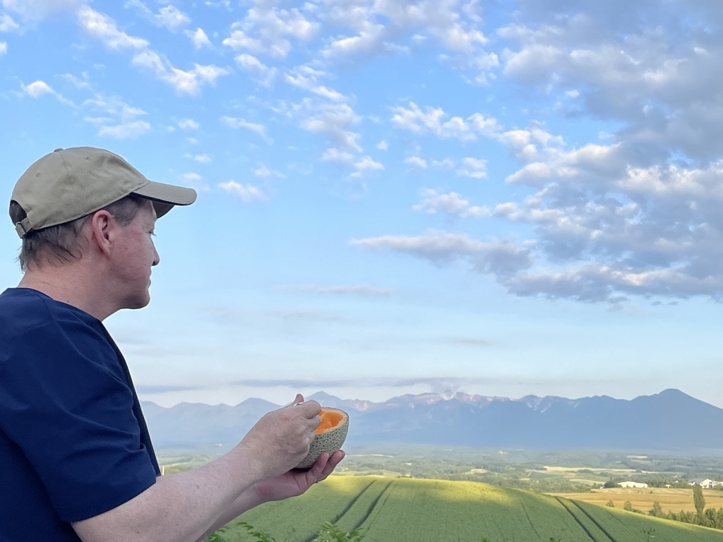 Jerry looking at landscape eating Yubari melon