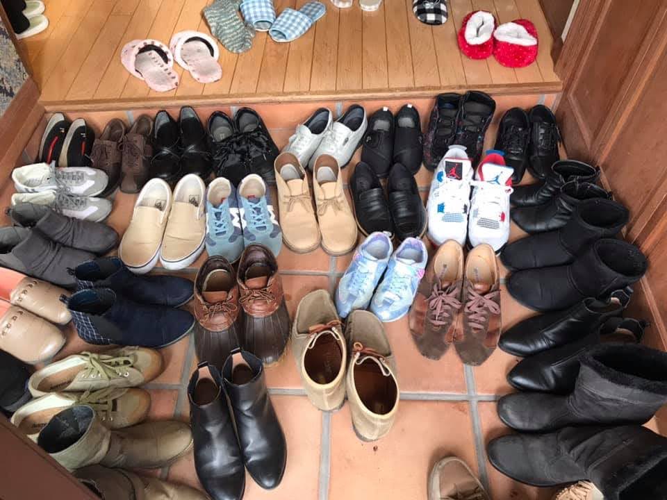 Many shoes in doorway in Japan