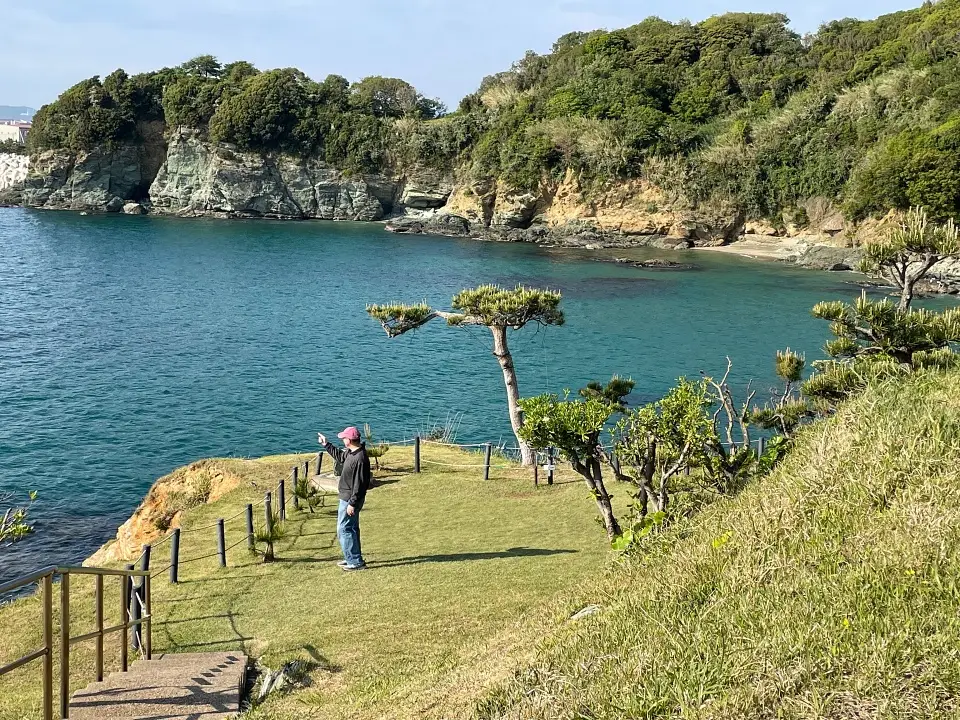 Man looking at ocean from Japanese garden in Wakayama Japan