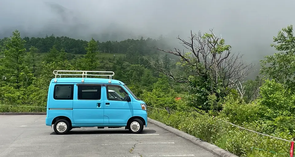 Blue van in parking lot in Nagano Japan